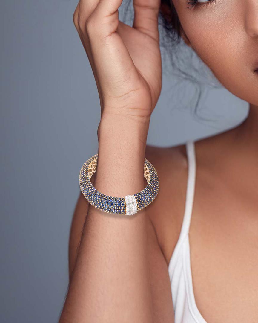 A blue sapphire and diamond bangle