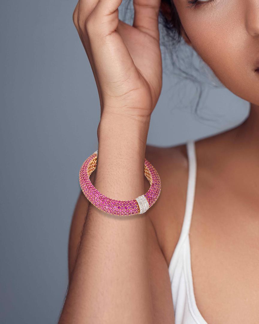 A pink sapphire and diamond bangle